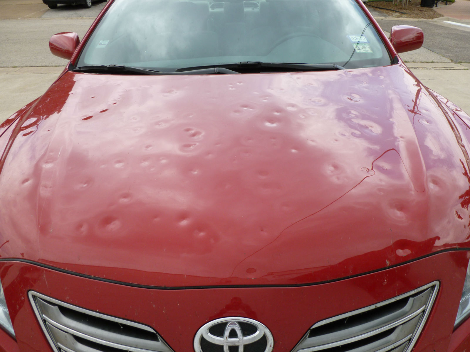 Toyota Camry Hood Pummeled by Baseball Sized Hail - Dent Biz